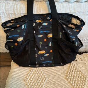 LESPORTSAC Travel bag. Used one time. No zipper at top